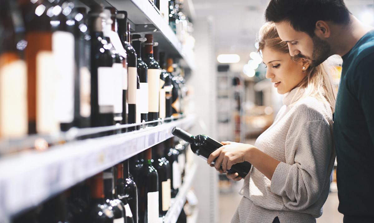 Couple buying some wine.